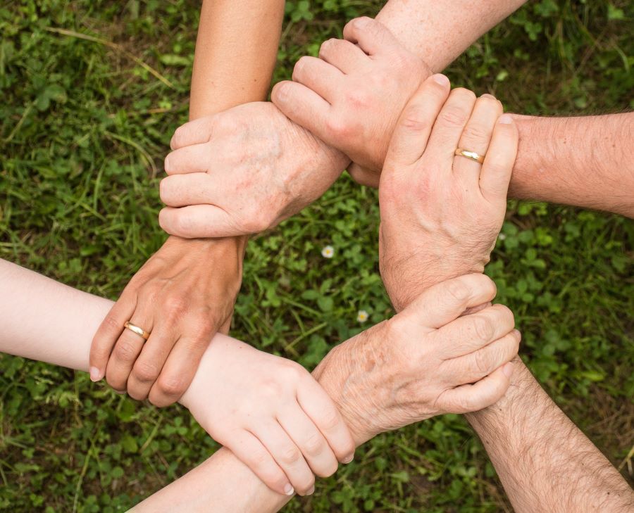 Image of group holding hands